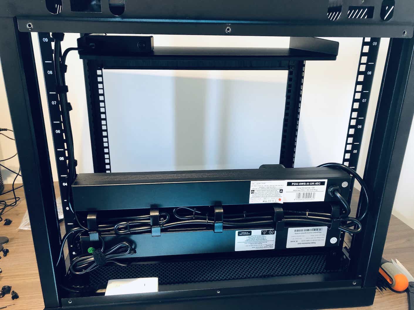 Fixing PDU units into 9U rack cabin for Unifi UDM Pro